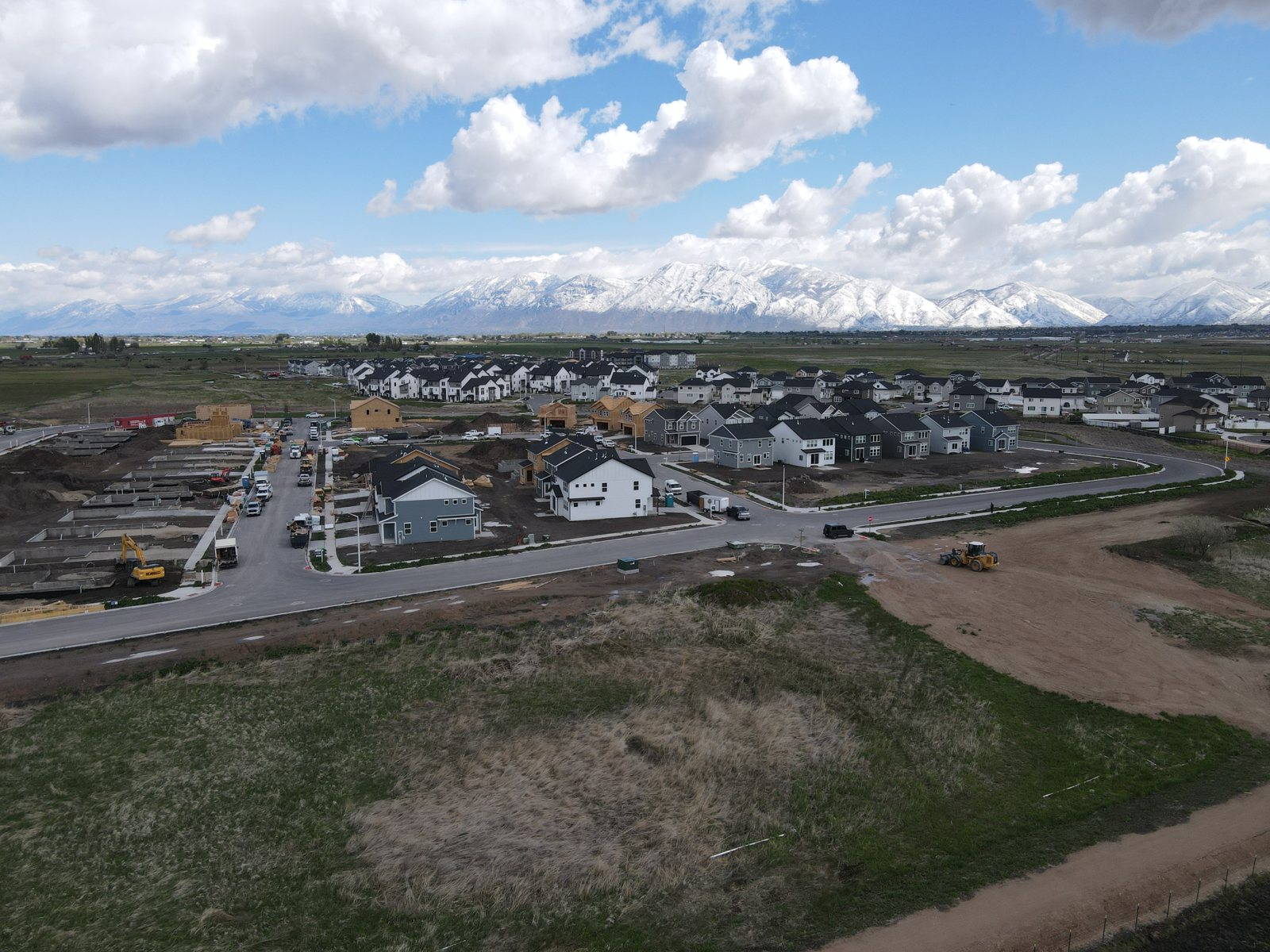 Aerial view of The Villages at Arrowhead Park in Payson with snowcapped mountains behind
